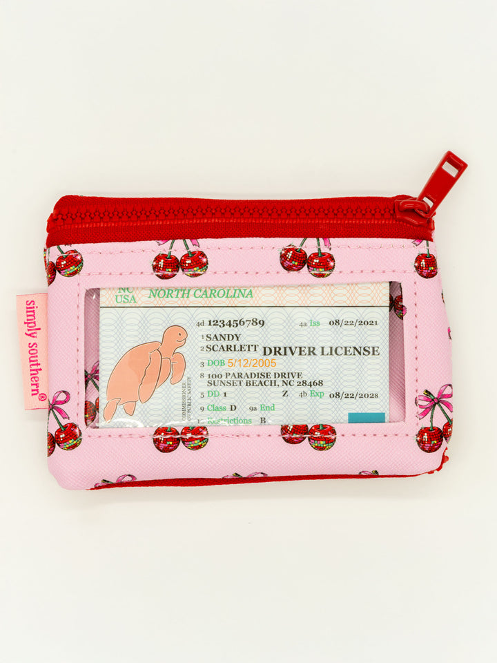 Small pink/red ID wallet with cherry print, zip pocket, clear ID window, "simply southern" tag. Sizes: small.