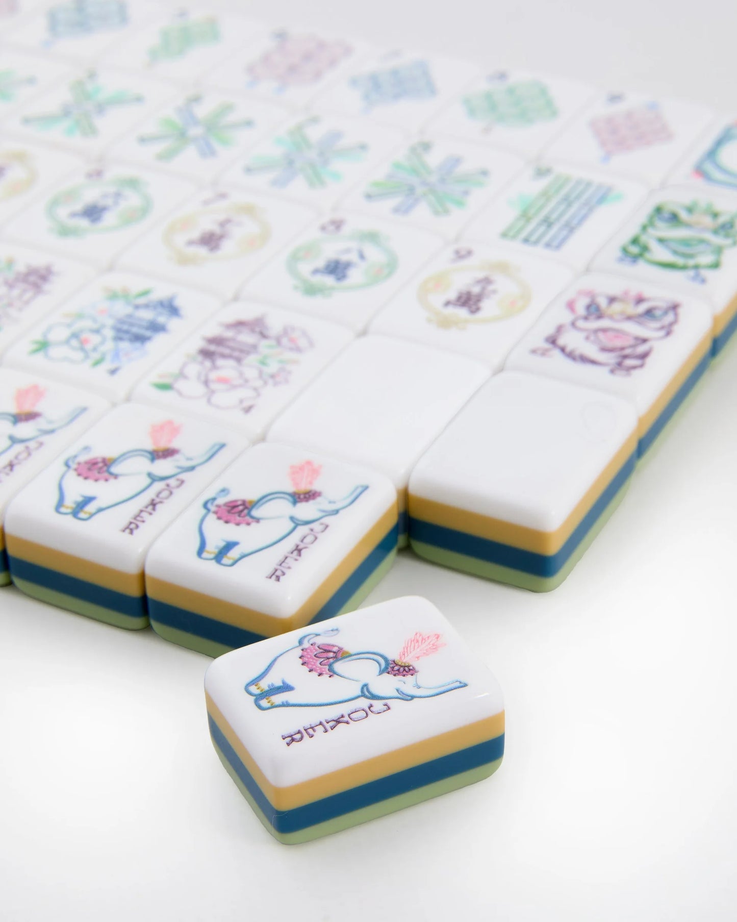 Willow Mahjong Tile with blue elephant and pink accents, featuring animal and floral illustrations. Available in multiple sizes.