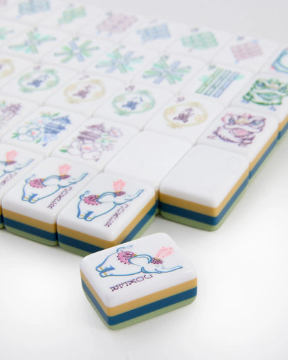 Willow Mahjong Tile with blue elephant and pink accents, featuring animal and floral illustrations. Available in multiple sizes.