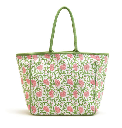 White cotton tote with green handles, pink floral and green vine print. Spacious design. Available in one size.