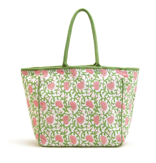 White cotton tote with green handles, pink floral and green vine print. Spacious design. Available in one size.