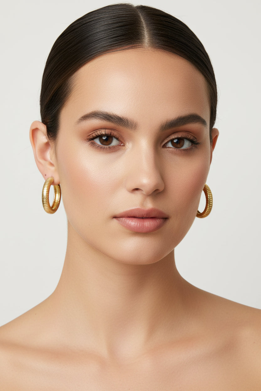 Elegant Hoop Earrings in small, medium, and large sizes. Simple, polished finish highlights classic hoop design.