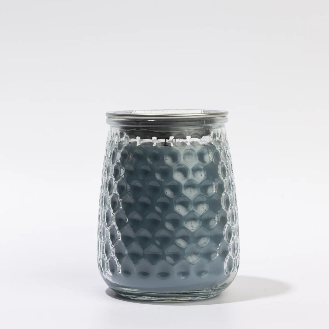 Laurel Grove 13oz blue candle in a textured clear glass jar with metal lid.