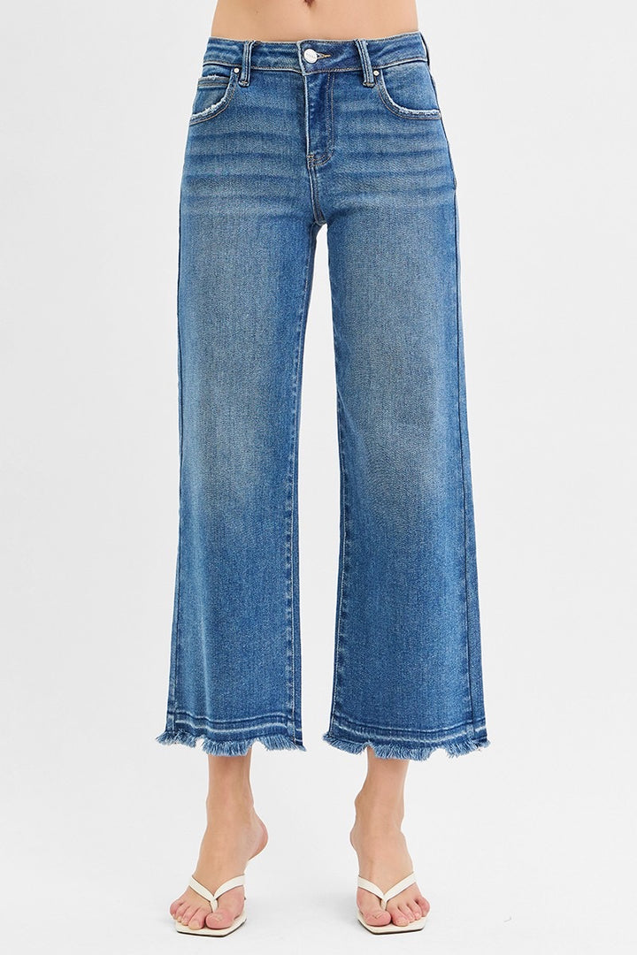 Mid Rise Crop Wide Jeans in medium wash denim with frayed hems. Available in sizes 24–32.