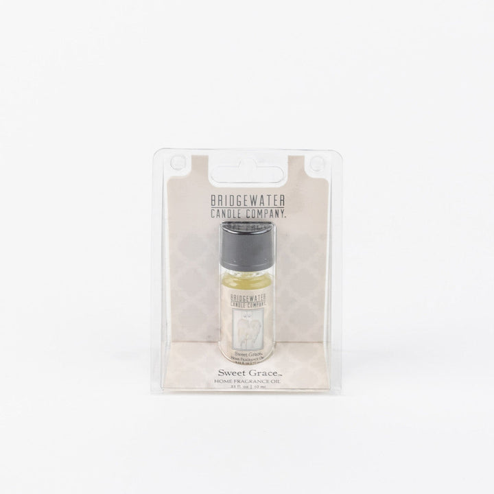 Sweet Grace Home Fragrance Oil in clear plastic packaging; small bottle. Available sizes: 10ml, 15ml.