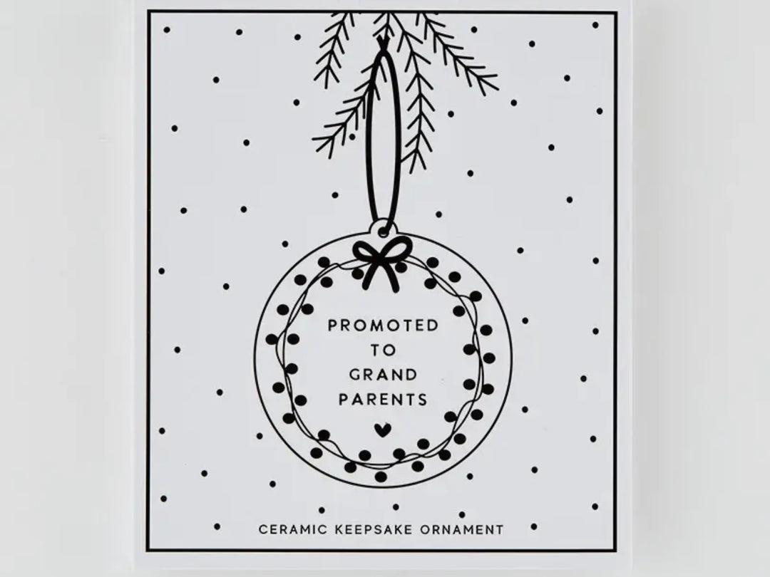 Round Promoted to Grandparents ceramic keepsake ornament with a wreath design.