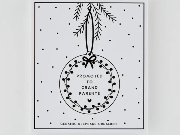 Round Promoted to Grandparents ceramic keepsake ornament with a wreath design.