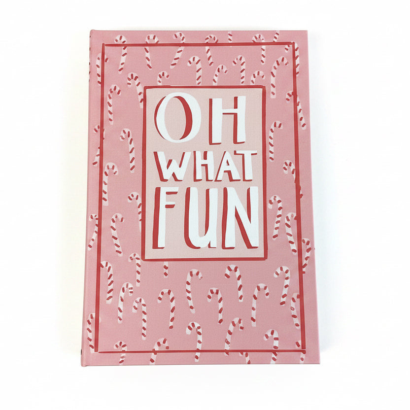 Rectangular pink canvas book storage box with a candy cane pattern and “OH WHAT FUN” text.