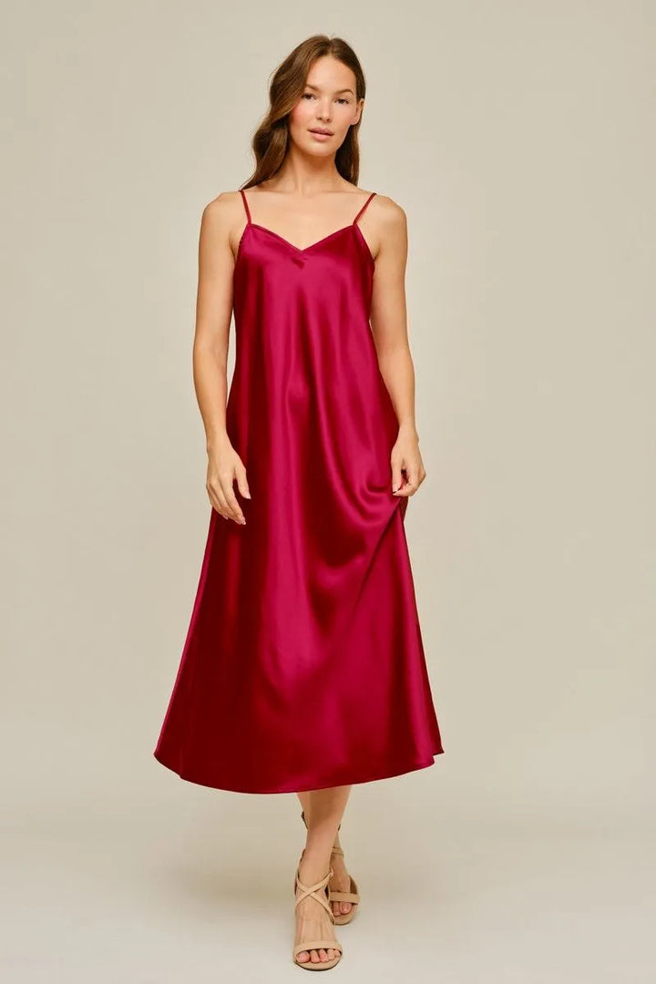 Magenta satin midi dress with spaghetti straps. Sizes available.