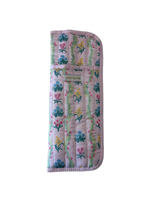 Pastel quilted hair tools sleeve with floral pattern, flap closure, and "Jane Marie" label. Available in small and large sizes.