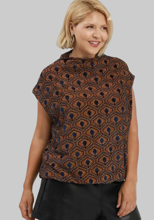Rust velvet mock neck top with a blue and black geometric diamond pattern and bubble silhouette. Available in various sizes.