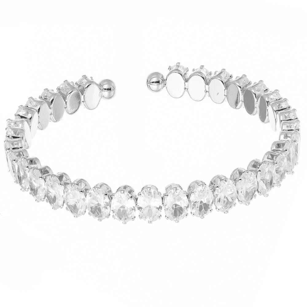 Silver cuff with two rows of oval clear crystals and round metallic ends. Available sizes: S, M, L.