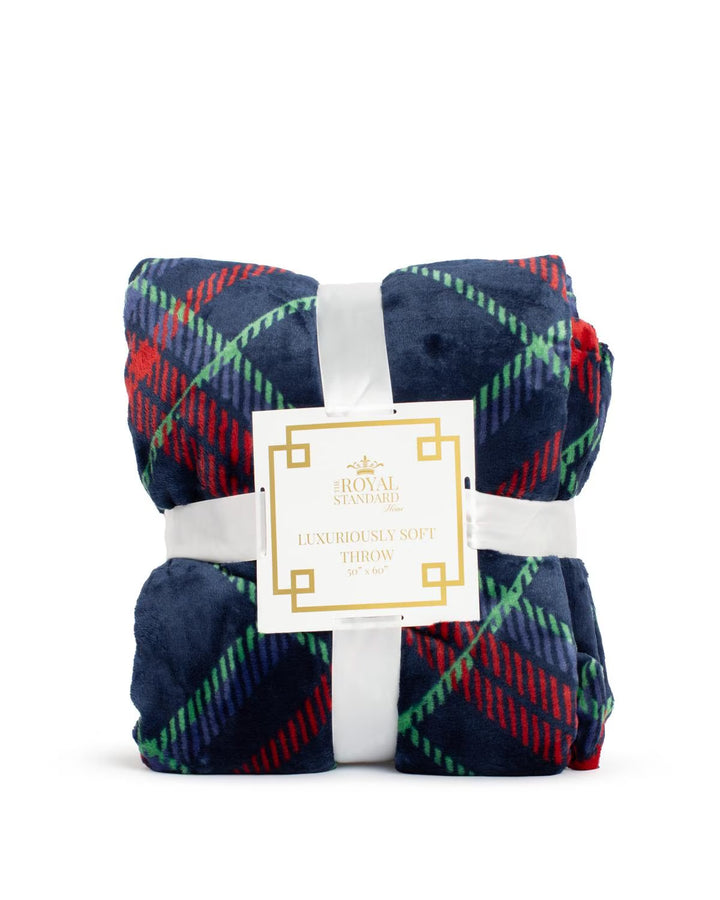 Folded navy blue Layton Plaid Throw with red and green pattern, 50” x 60″.