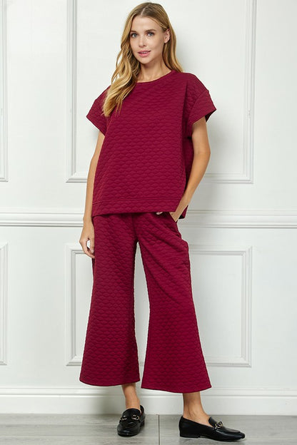 Honey Comb Textured Set in burgundy with wide-leg pants; available in sizes XS-XL.