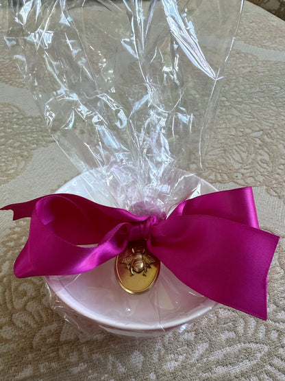 French Bee Candles white bowl in clear plastic, pink ribbon, and gold wax seal. Available in small, medium, and large sizes.