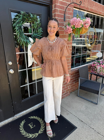 Gingham Tie Blouse in brown and cream checks with flutter sleeves, available in sizes XS–XL.