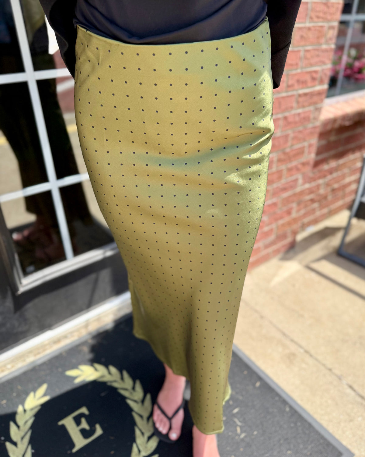 Olive green polka dot satin midi skirt. Available in sizes XS-XL.