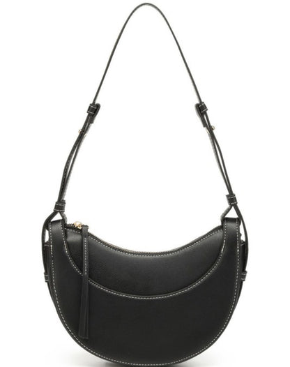 Black vegan leather crescent crossbody with white stitching, zip top, tassel, adjustable strap. Sizes: S, M, L.