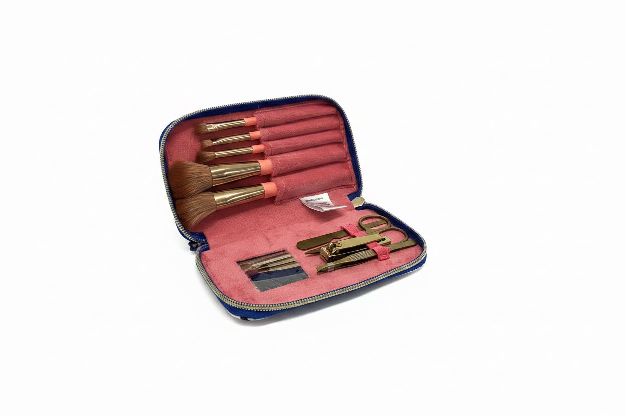 Blue gingham zippered cosmetic kit with pink interior, five brushes, scissors, tweezers, nail clippers. Sizes: small, medium.