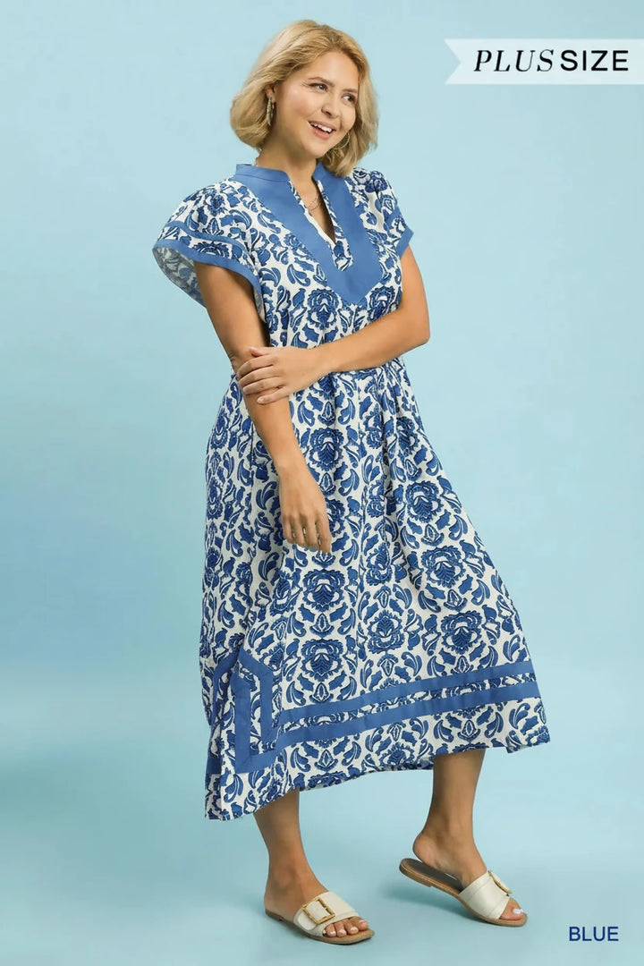 Blue Abstract Two Tone Print Midi Dress with short sleeves and knee-length, flowy silhouette; available in sizes XS-XL.