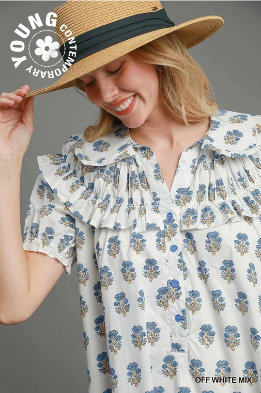 Bubble Sleeve Dress with blue and mustard floral pattern, ruffled shoulders, blue buttons. Available in sizes XS–L.