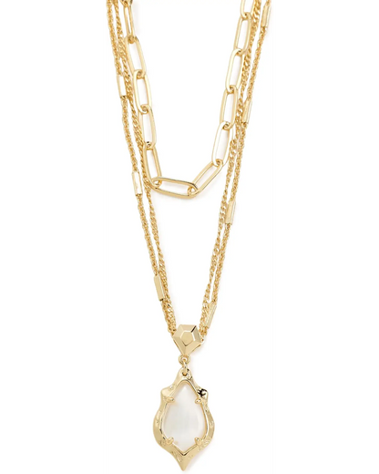 Gold necklace with two textured chains, one paperclip chain, and an abstract iridescent stone pendant. Available in 16", 18".