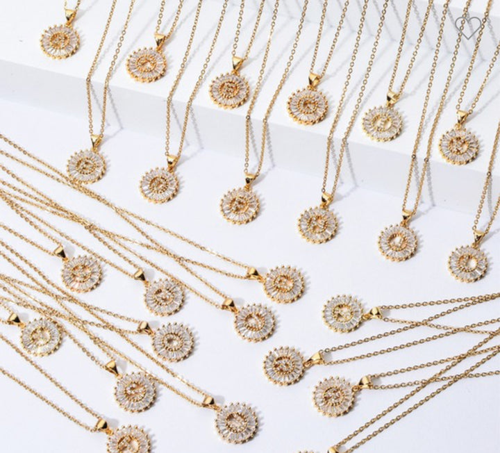 Stainless steel necklaces with CZ initial pendants. Available in 16", 18", and 20" lengths.