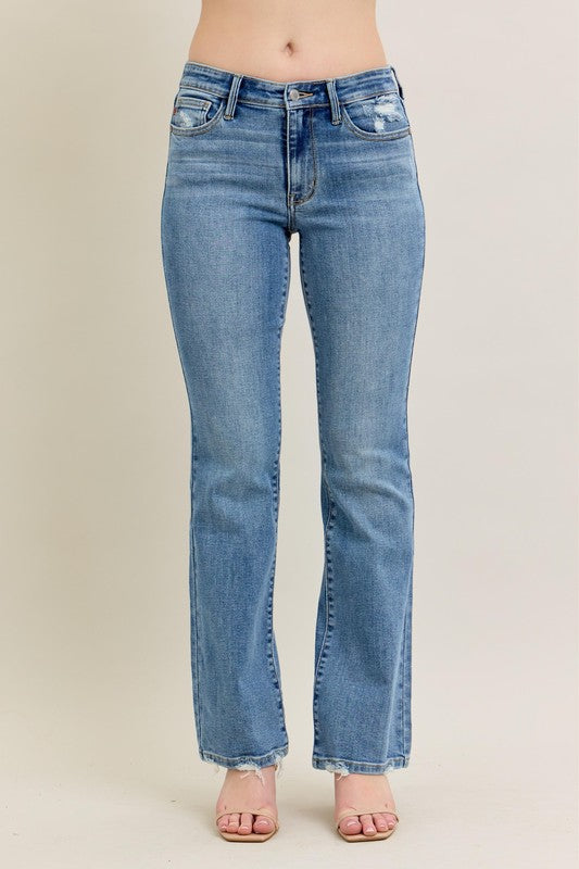 Judy Blue Vintage Wash Boot Cut Jeans in light blue with high waist and slight pocket distressing. Sizes: 24–32.