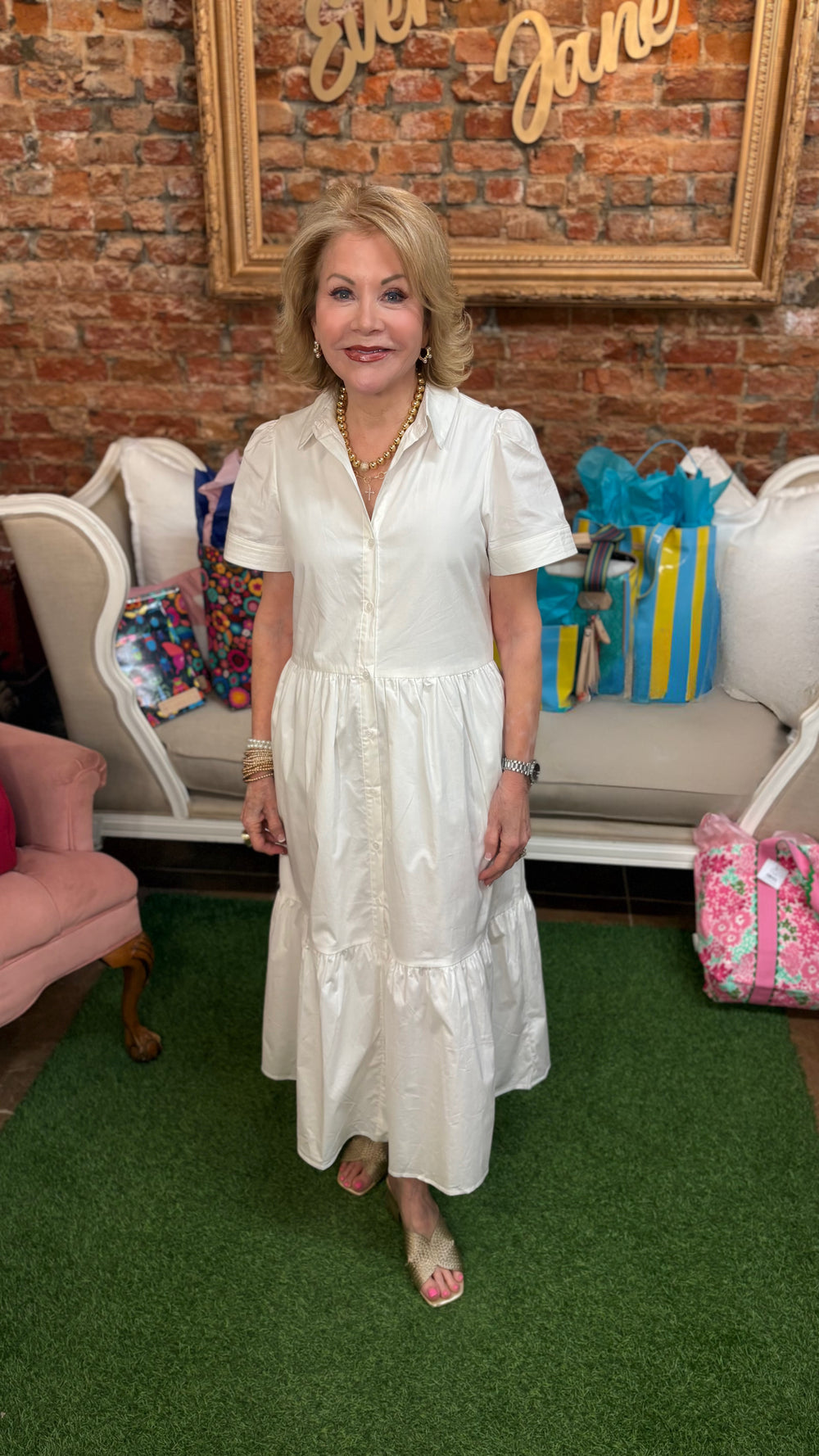 Jema White Dress, available in sizes XS–XL, features a fitted silhouette and short sleeves.