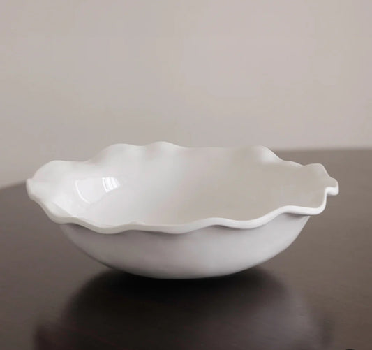 White, scalloped-edged ceramic bowl with a smooth, glossy finish. Available sizes: Medium (10"), Large (12").