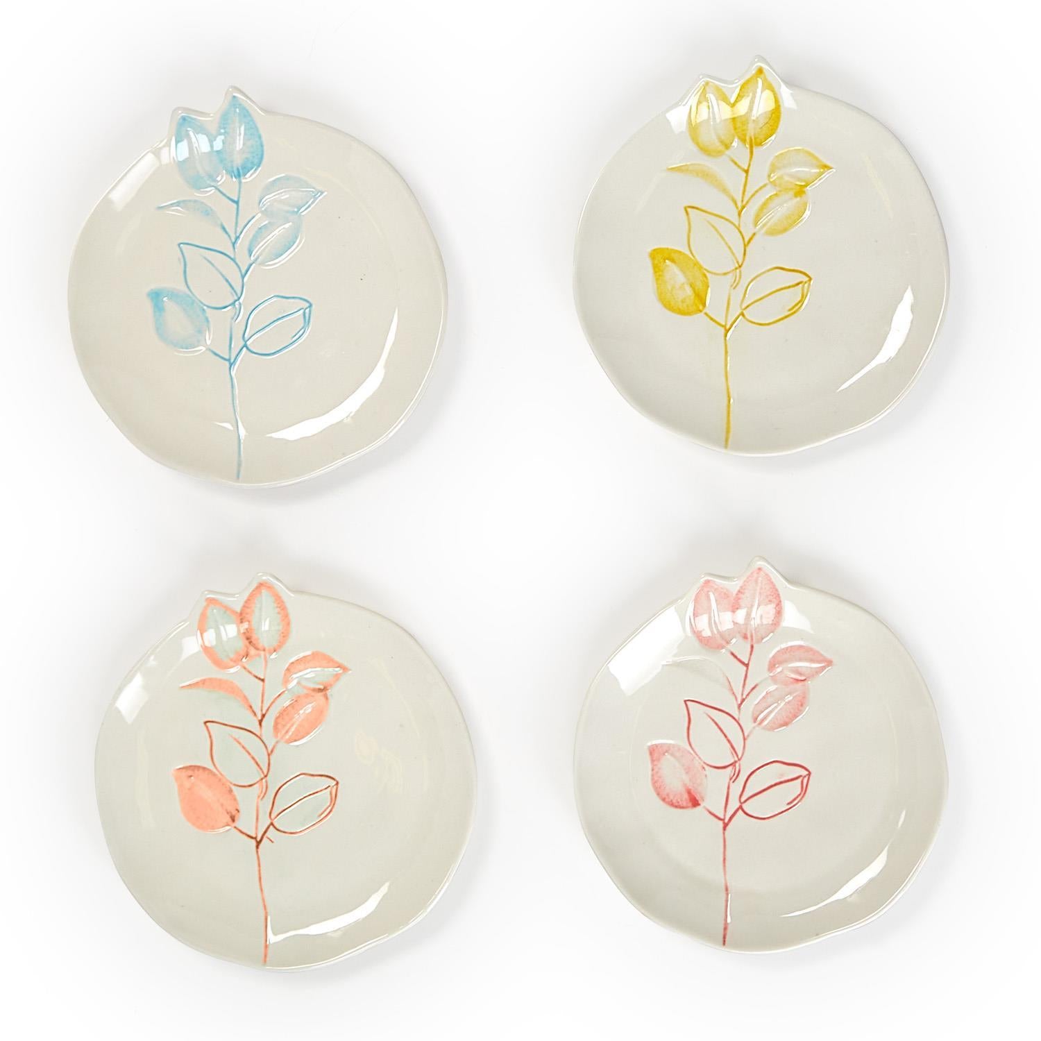 Set of four round plates with unique blue, yellow, orange, or pink floral designs. Each plate is 6" diameter.