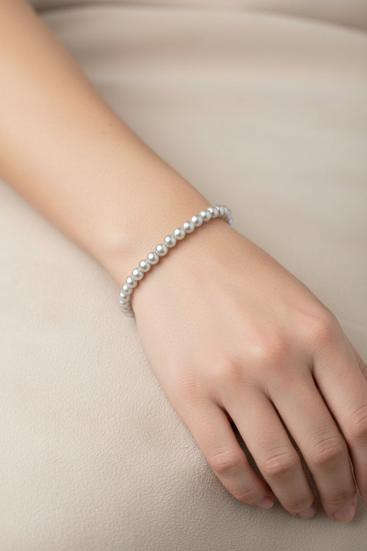 Water Resistant Beaded Stretch Bracelet, available in S/M/L sizes. Features round beads on an elastic band.