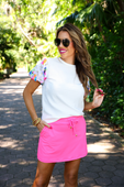 Solid Neon Pink Skort available in sizes XS–XL. Bright, fitted, mid-thigh length skort with clean lines and no embellishments.