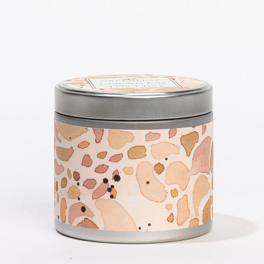 Cashmere Kiss 4 oz. round silver tin candle with a peach terrazzo label and "GREENLEAF Cashmere Kiss" on the lid.