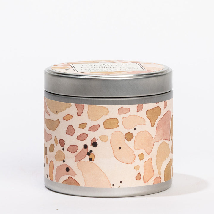 Cashmere Kiss 4 oz. round silver tin candle with a peach terrazzo label and "GREENLEAF Cashmere Kiss" on the lid.