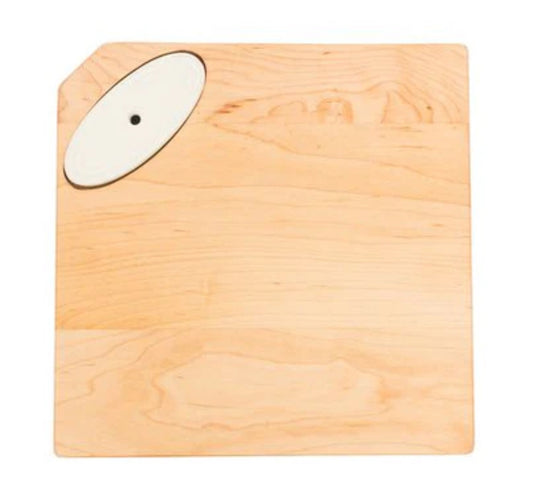 **The Maple Cheese Board by J.K. Adams**

- Square wooden cutting board
- Light natural finish
- Oval-shaped white ceramic accent in the top left corner
- Crafted from maple wood with a slightly rounded corner opposite the ceramic accent

**Available Sizes:**
- 10" x 10"

