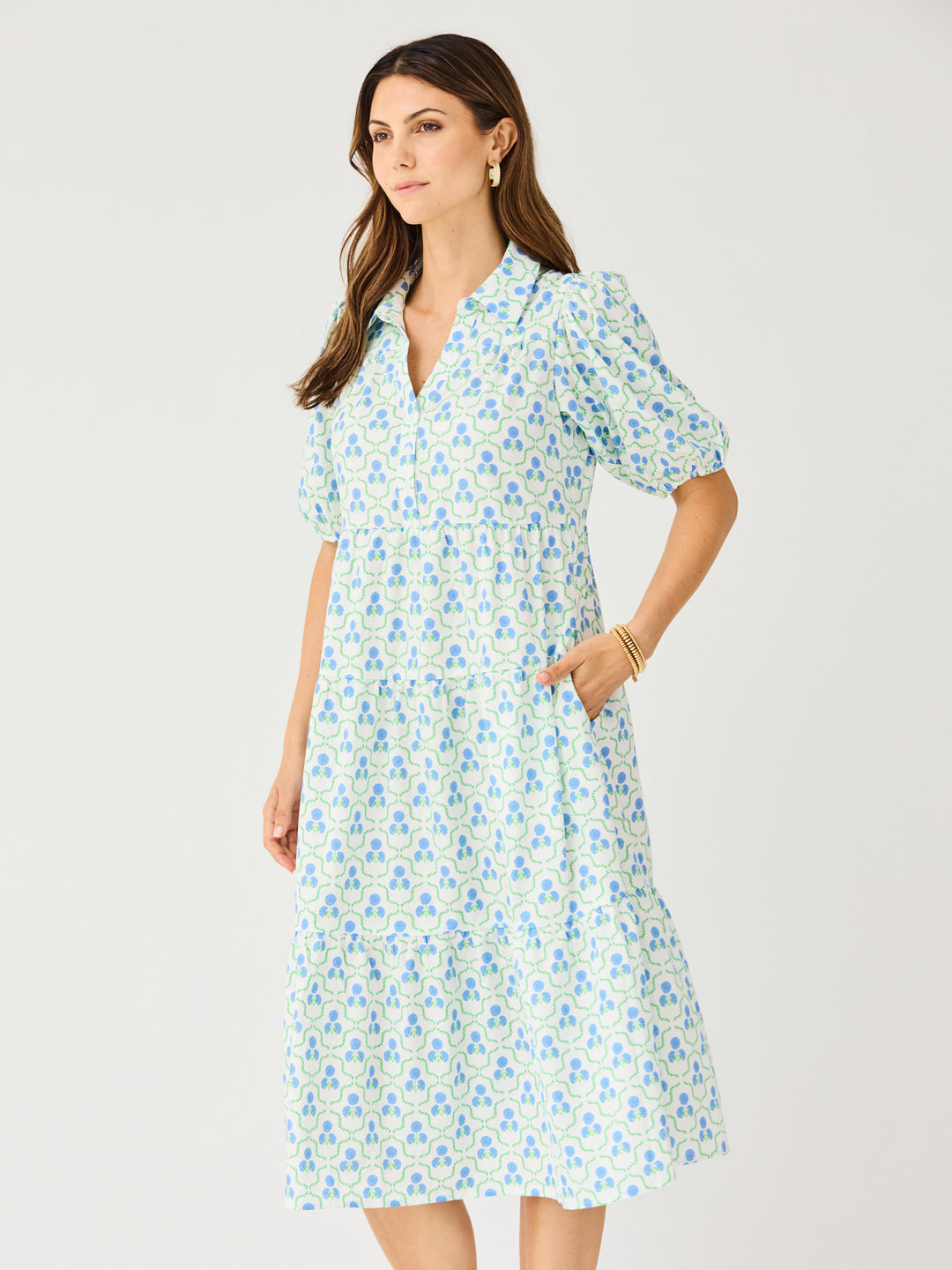 Eloise Sweetbriar Lattice Dress: white tiered midi, blue/green floral print, puff sleeves, pockets. Sizes XS–XL.