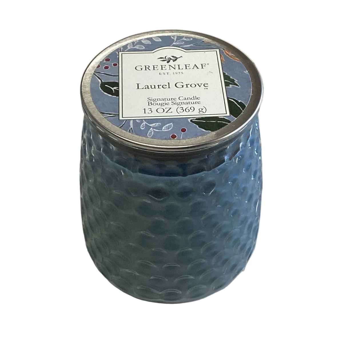 Blue textured Laurel Grove candle with a silver floral lid, labeled “Greenleaf Laurel Grove Signature Candle, 13 oz (369 g).” Size available: 13oz.