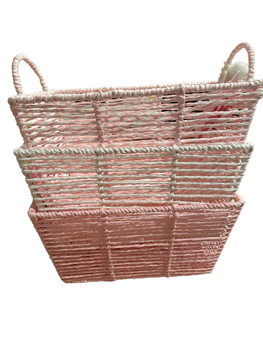 A Rectangle Baskets with handles, featuring alternating shades of pink and white. the basket's texture is highlighted by its interwoven design.