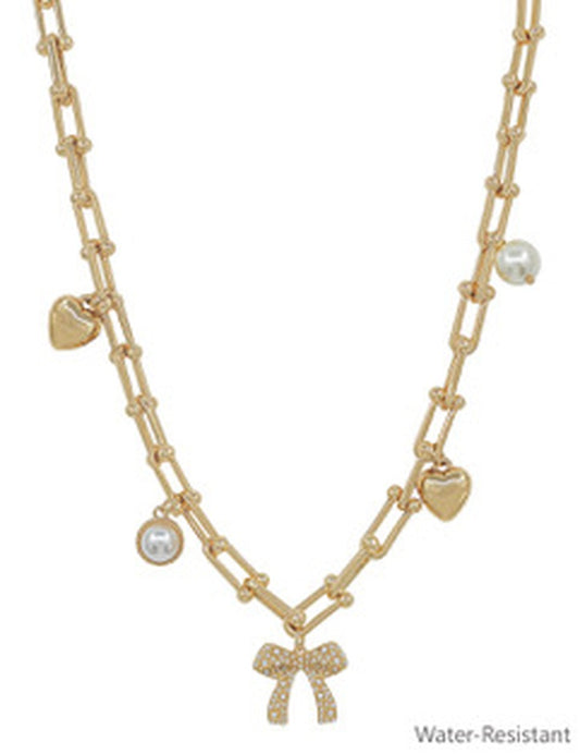 Evan Gold Pearl Necklace with chain-link, bow, pearls, and heart charms. Available in 16", 18", and 20". Water-resistant.