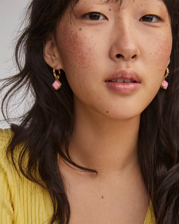 Mallory Rose Gold Huggie Earrings by Kendra Scott with vintage-inspired pink gemstones. Available in small and medium sizes.
