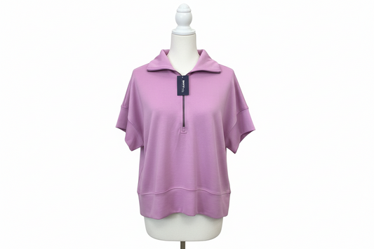 Lilac Short Sleeve Zip Up Top by White Birch with collar, half-zip front, breathable fabric. Available in S-XL.