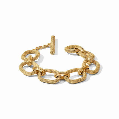 Cheval Link Bracelet: 24K gold, large textured interlocking oval links, bar-and-toggle clasp. Sizes available: S, M, L.