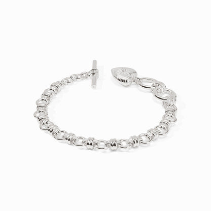 Silver bracelet with interlocking circular links, toggle clasp, and textured heart-shaped cubic zirconia charm. Sizes: S, M, L.