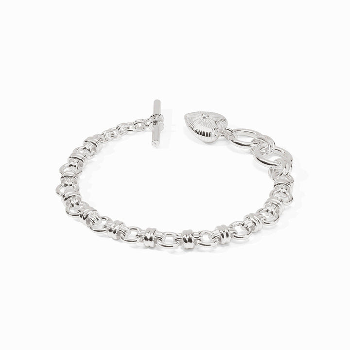 Silver bracelet with interlocking circular links, toggle clasp, and textured heart-shaped cubic zirconia charm. Sizes: S, M, L.