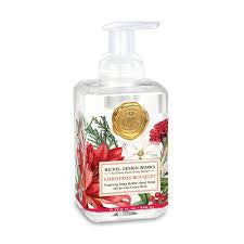 Christmas Bouquet Foaming Soap in an 8.75 fl. oz. clear bottle with a white pump, featuring a red poinsettia and greenery label with a gold seal.