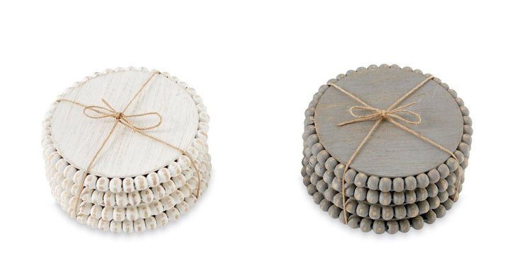 4" round beaded edge wooden coaster sets: one white marble-look, one gray, each tied with twine.