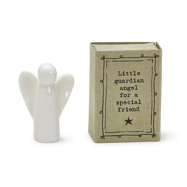 Small white ceramic angel with brown gift box labeled "Little guardian angel for a special friend." Size: pocket-sized.