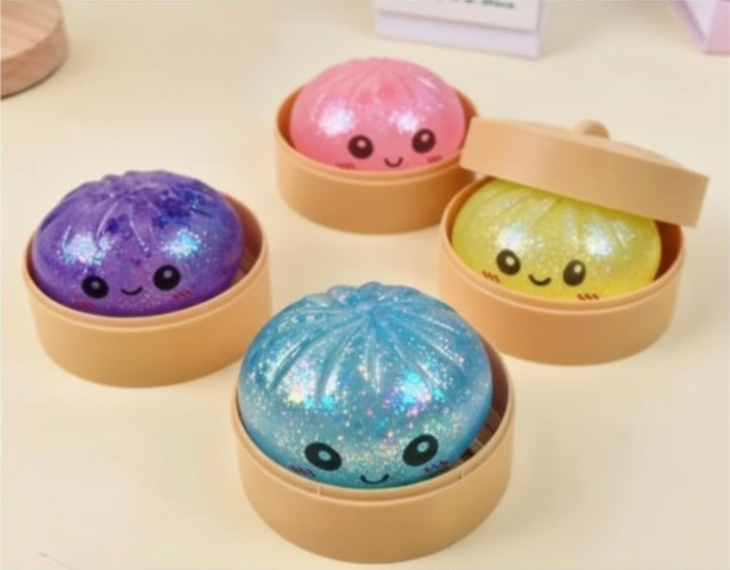 Glittery Squeezy Dumplings with smiling faces in pink, yellow, purple, and blue. Available sizes: small, medium, large.