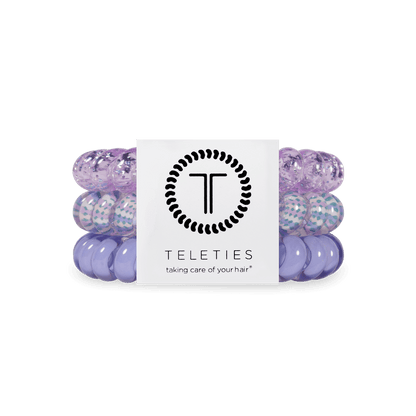 Set of three purple coiled TELETIES hair ties with branded card; available in small and large sizes.